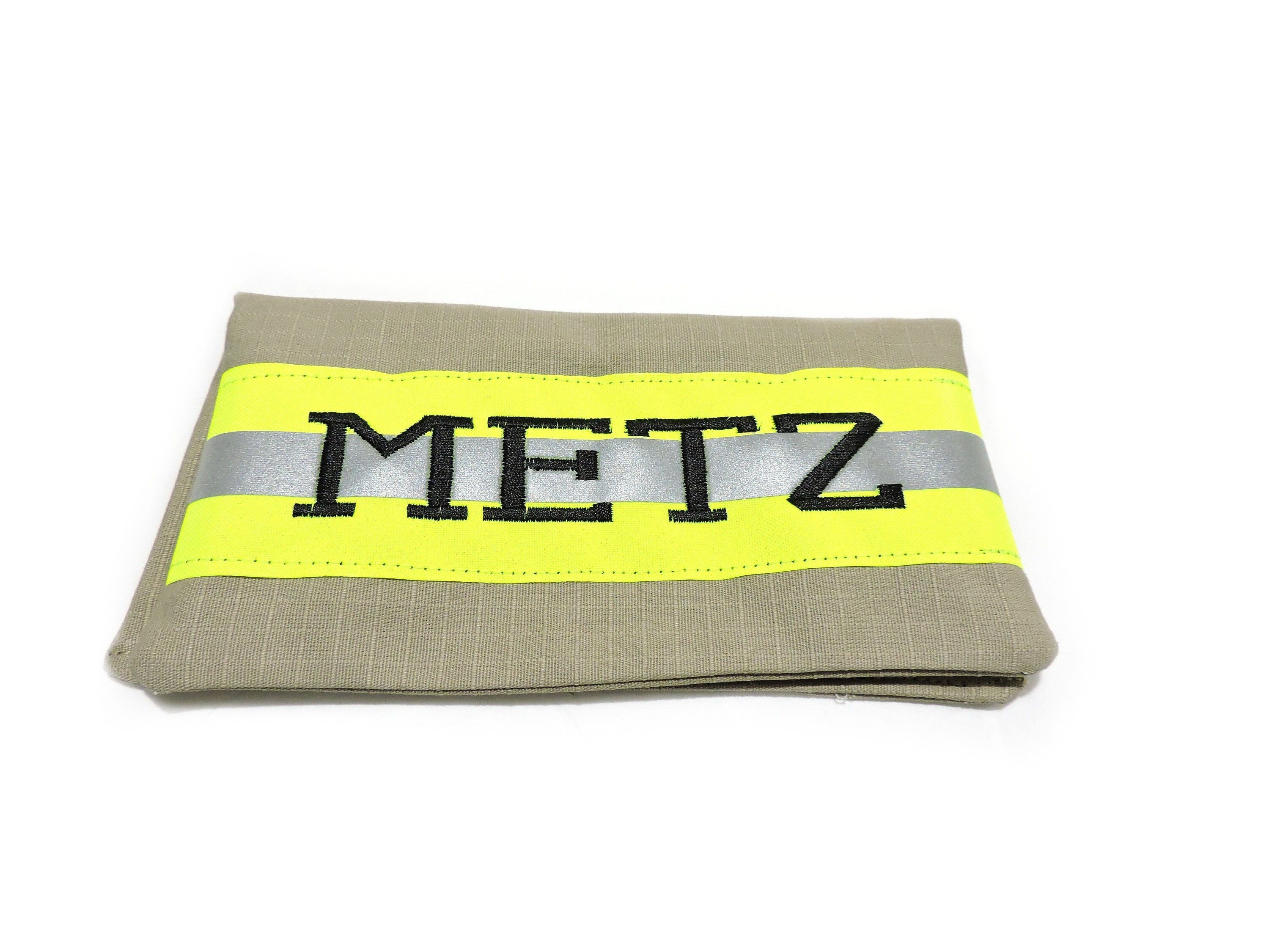 tan fabric with neon yellow reflective tape. Firefighter Checkbook cover with a name embroidered on the front.