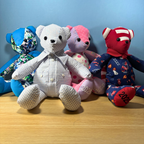 Collection of four memory bears that were made from loved ones clothing. Can be made from adult or baby clothes