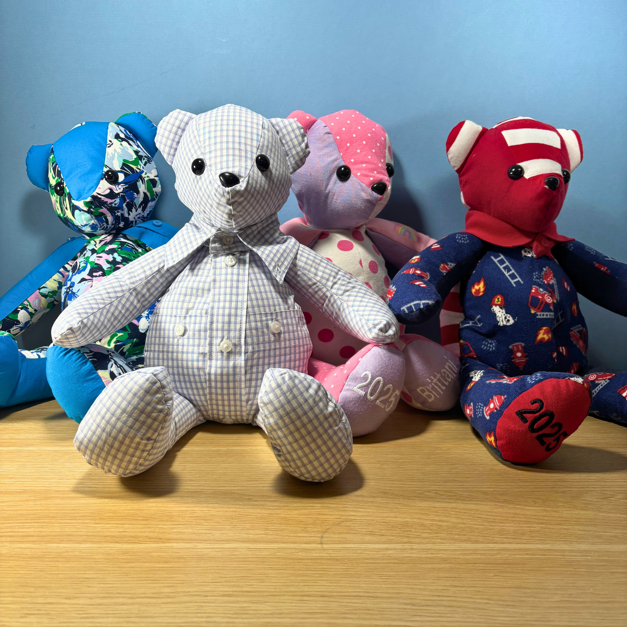 Collection of four memory bears that were made from loved ones clothing. Can be made from adult or baby clothes
