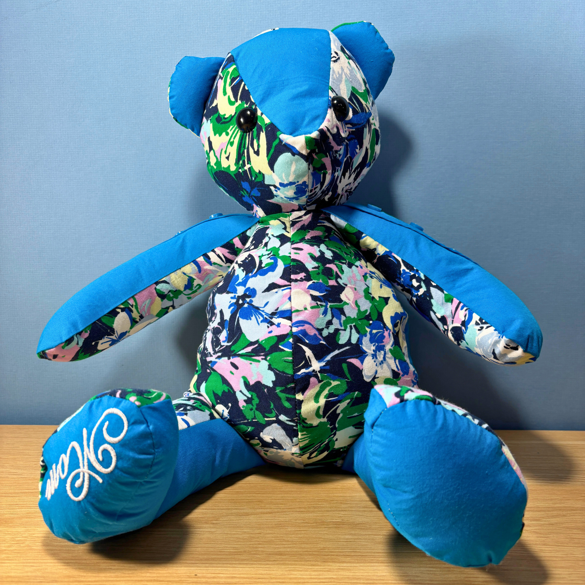 Memory Bear Made out of your loved ones clothing  this bear was made from two womans shirts. a blue shirt and a flower shirt 
