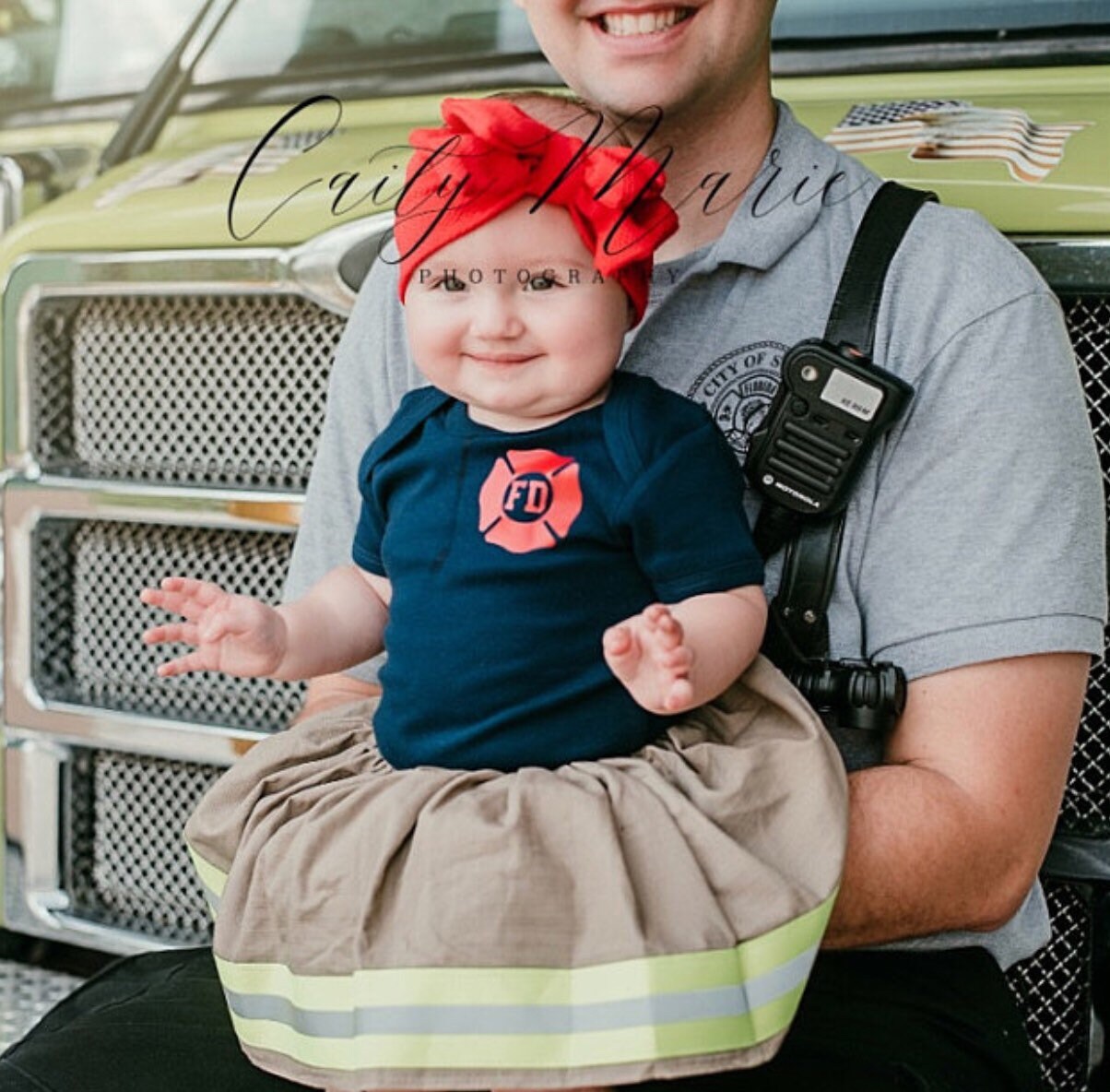 baby girl wearing baby girl firefighter outfit