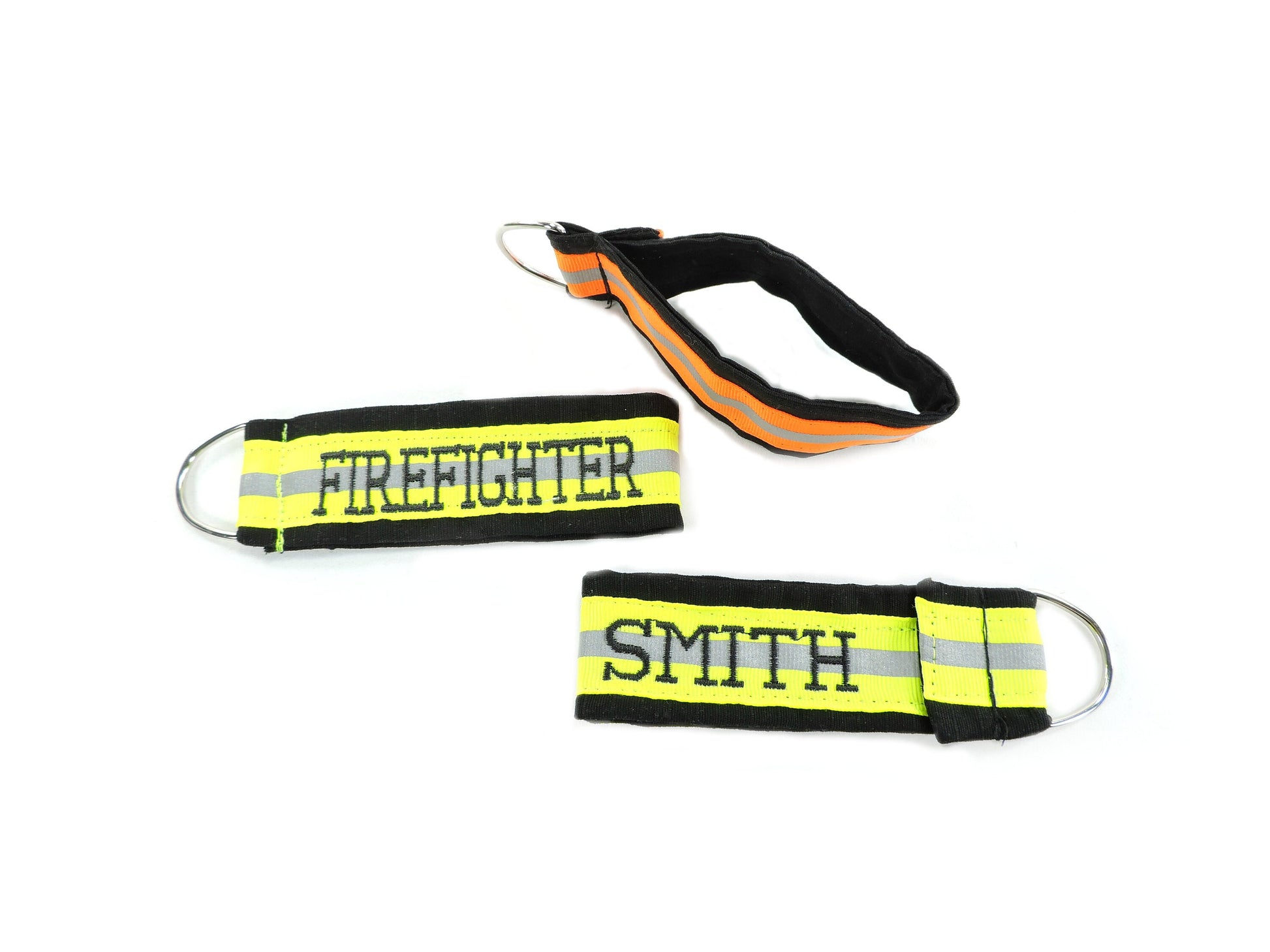 Showing the front back and side of the firefighter keychain