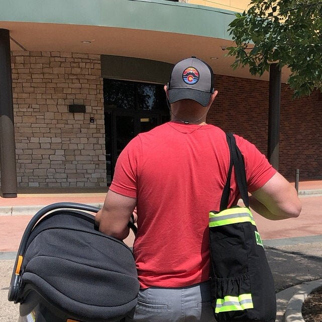 dad caring firefighter diaper bag