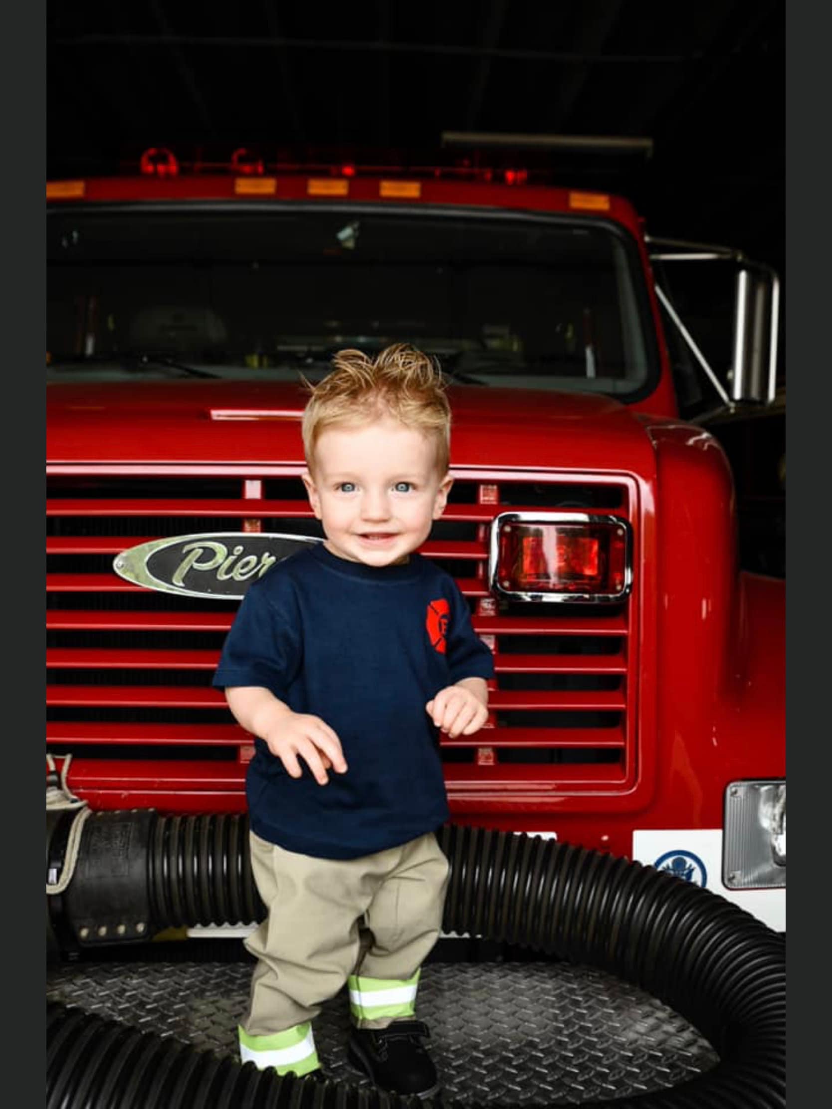 Toddler wearing a firefighter toddler boy outfit