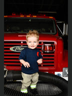 Toddler wearing a firefighter toddler boy outfit