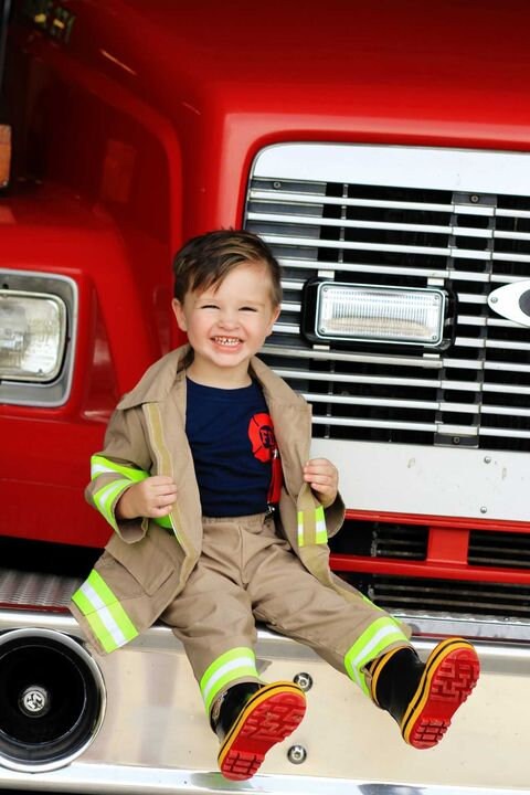 Toddler boy wearing Firefighter toddler boy outfit and jacket